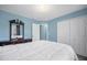 Comfortable bedroom with a queen bed, carpet, and light blue walls at 31 Churchill Downs Ne, Cartersville, GA 30121