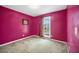 Bedroom with carpet flooring, pink walls, and one window at 31 Churchill Downs Ne, Cartersville, GA 30121