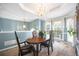 Formal dining room featuring a chandelier, large windows, and elegant decor at 31 Churchill Downs Ne, Cartersville, GA 30121