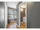 Hallway view leading to a small bathroom with a single vanity and tile flooring at 31 Churchill Downs Ne, Cartersville, GA 30121