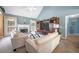 Comfortable living room with fireplace, entertainment center, and large windows at 31 Churchill Downs Ne, Cartersville, GA 30121