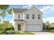 Charming two-story home featuring a light brick facade and attached two-car garage at 4191 Brindle Pl, Loganville, GA 30052