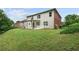 Expansive backyard with lush lawn, a covered patio, and beautiful landscaping, perfect for outdoor activities at 5484 Stone Cove Sw Dr, Atlanta, GA 30331