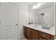 Elegant bathroom featuring a vanity, tiled floors, and ample natural light at 5484 Stone Cove Sw Dr, Atlanta, GA 30331