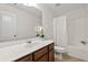 Updated bathroom with modern vanity, and a shower-tub combo at 5484 Stone Cove Sw Dr, Atlanta, GA 30331