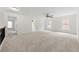 Large bedroom boasts soft carpet, ceiling fan, and two windows at 5484 Stone Cove Sw Dr, Atlanta, GA 30331