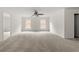 Spacious bedroom features neutral carpeting and a ceiling fan at 5484 Stone Cove Sw Dr, Atlanta, GA 30331
