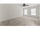 Bright, spacious bedroom with plush carpeting, large windows, and neutral paint at 5484 Stone Cove Sw Dr, Atlanta, GA 30331