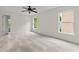Spacious bedroom with large windows, neutral decor, and plush carpeting at 5484 Stone Cove Sw Dr, Atlanta, GA 30331