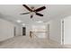 Large, carpeted bedroom with a ceiling fan and easy access at 5484 Stone Cove Sw Dr, Atlanta, GA 30331