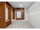 Spacious walk-in closet with custom shelving and ample storage space at 5484 Stone Cove Sw Dr, Atlanta, GA 30331