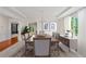 Formal dining room with a chandelier, large window, and elegant decor at 5484 Stone Cove Sw Dr, Atlanta, GA 30331