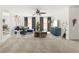 Bright living room with neutral carpet, a ceiling fan, and stylish decor for a modern feel at 5484 Stone Cove Sw Dr, Atlanta, GA 30331