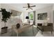 Bright office space with a ceiling fan, natural light, stylish decor, and a comfortable seating area at 5484 Stone Cove Sw Dr, Atlanta, GA 30331