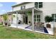 Inviting covered patio with a dining area, string lights, and outdoor decor, ideal for gatherings at 5484 Stone Cove Sw Dr, Atlanta, GA 30331