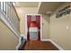 Finished basement stairway leading to a home theatre featuring plush seating and decor at 7320 Oak Arms Dr, Villa Rica, GA 30180