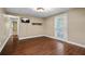 Finished basement featuring stylish wood flooring, TV area, and painted decorative door at 7320 Oak Arms Dr, Villa Rica, GA 30180
