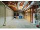 Unfinished basement with exposed ceiling and utilities, offering potential for customization at 7320 Oak Arms Dr, Villa Rica, GA 30180