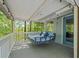 Relaxing deck with hanging bed, views, and outdoor lighting at 7320 Oak Arms Dr, Villa Rica, GA 30180