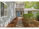 Inviting front entrance with a blue front door and landscaped walkway at 7320 Oak Arms Dr, Villa Rica, GA 30180
