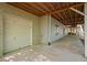 Attached garage with concrete flooring and side door, providing ample parking and storage at 7320 Oak Arms Dr, Villa Rica, GA 30180
