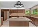 Well-equipped kitchen with tiled floor, granite countertops, and a center island with a built-in cooktop at 7320 Oak Arms Dr, Villa Rica, GA 30180