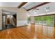 Bright living room with hardwood floors, and sliding glass doors to the deck at 7320 Oak Arms Dr, Villa Rica, GA 30180