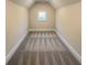 Finished attic space featuring plush carpeting and a window at 1021 Liberty Springs Dr, Woodstock, GA 30188