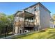Exterior view of the house, featuring a deck and fenced yard at 1021 Liberty Springs Dr, Woodstock, GA 30188