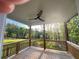 Relaxing covered back porch with ceiling fan overlooking the private fenced backyard at 1021 Liberty Springs Dr, Woodstock, GA 30188