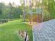 Aerial view of the serene backyard with lush greenery and mature trees at 1021 Liberty Springs Dr, Woodstock, GA 30188