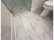 Bathroom featuring elegant marble floor tiles, complemented by a modern toilet at 1021 Liberty Springs Dr, Woodstock, GA 30188