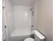 Bathroom featuring a white tub/shower combo with sleek tile and modern fixtures at 1021 Liberty Springs Dr, Woodstock, GA 30188