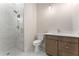 Modern bathroom with a glass-enclosed shower, marble tiles, and a stylish vanity at 1021 Liberty Springs Dr, Woodstock, GA 30188