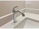 A shiny faucet paired with sleek bathroom countertop at 1021 Liberty Springs Dr, Woodstock, GA 30188