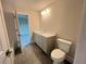 Well-lit bathroom features a vanity and toilet with modern fixtures at 1021 Liberty Springs Dr, Woodstock, GA 30188