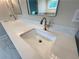 Bathroom vanity with double sinks, modern faucets, and a large countertop at 1021 Liberty Springs Dr, Woodstock, GA 30188