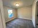 Cozy bedroom with large window, neutral carpet, and ample natural light at 1021 Liberty Springs Dr, Woodstock, GA 30188