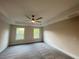 Spacious bedroom with tray ceiling, ceiling fan, and plenty of natural light at 1021 Liberty Springs Dr, Woodstock, GA 30188