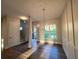 Open dining room with hardwood floors, chandelier, and natural light at 1021 Liberty Springs Dr, Woodstock, GA 30188