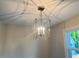 Dining room featuring a decorative chandelier and natural light from an adjacent window at 1021 Liberty Springs Dr, Woodstock, GA 30188