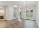 Bright dining area with hardwood floors and modern lighting at 1021 Liberty Springs Dr, Woodstock, GA 30188