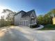 Charming home exterior with a concrete driveway and two car garage at 1021 Liberty Springs Dr, Woodstock, GA 30188