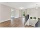 Hallway with natural lighting and views, enhanced by wood floors and a chandelier at 1021 Liberty Springs Dr, Woodstock, GA 30188
