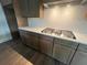 Gourmet kitchen with stainless steel gas cooktop and sleek countertops at 1021 Liberty Springs Dr, Woodstock, GA 30188
