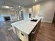Kitchen island featuring stainless steel fixtures and an eat-in area at 1021 Liberty Springs Dr, Woodstock, GA 30188
