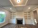 Spacious living room with built-in shelving, a fireplace, and coffered ceilings at 1021 Liberty Springs Dr, Woodstock, GA 30188
