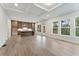 Open living space with modern kitchen, hardwood flooring, and natural light at 1021 Liberty Springs Dr, Woodstock, GA 30188