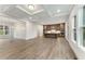 Inviting living space with hardwood floors, modern kitchen, and bright natural lighting at 1021 Liberty Springs Dr, Woodstock, GA 30188