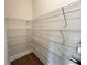 Walk-in pantry with wire shelving and hardwood floor at 1021 Liberty Springs Dr, Woodstock, GA 30188